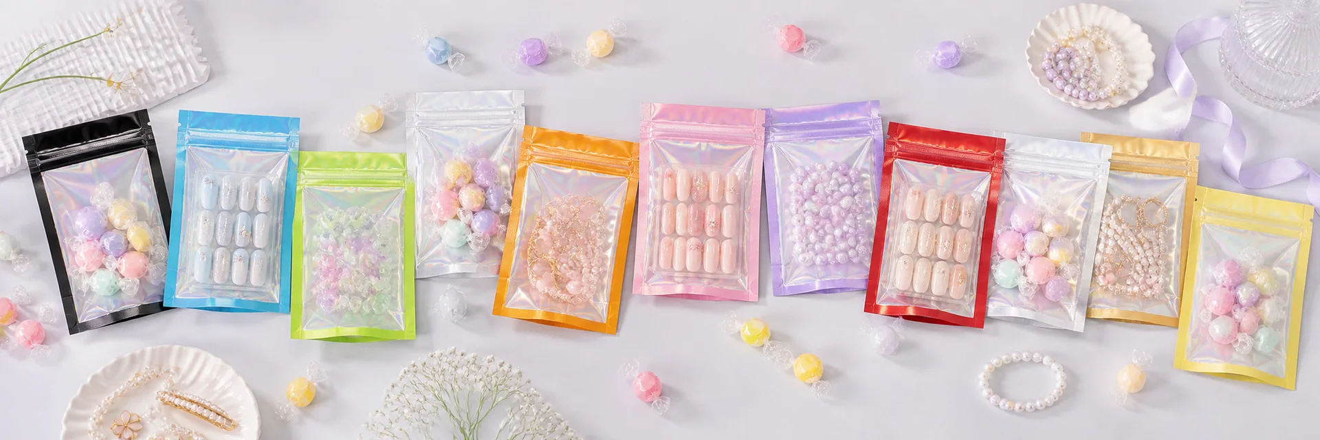 Eleven colorful holographic zipper bags filled with candy, beauty accessories, beads, and jewelry.